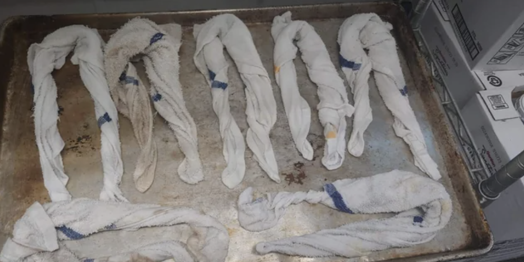 Rags twisted and lying on a tray