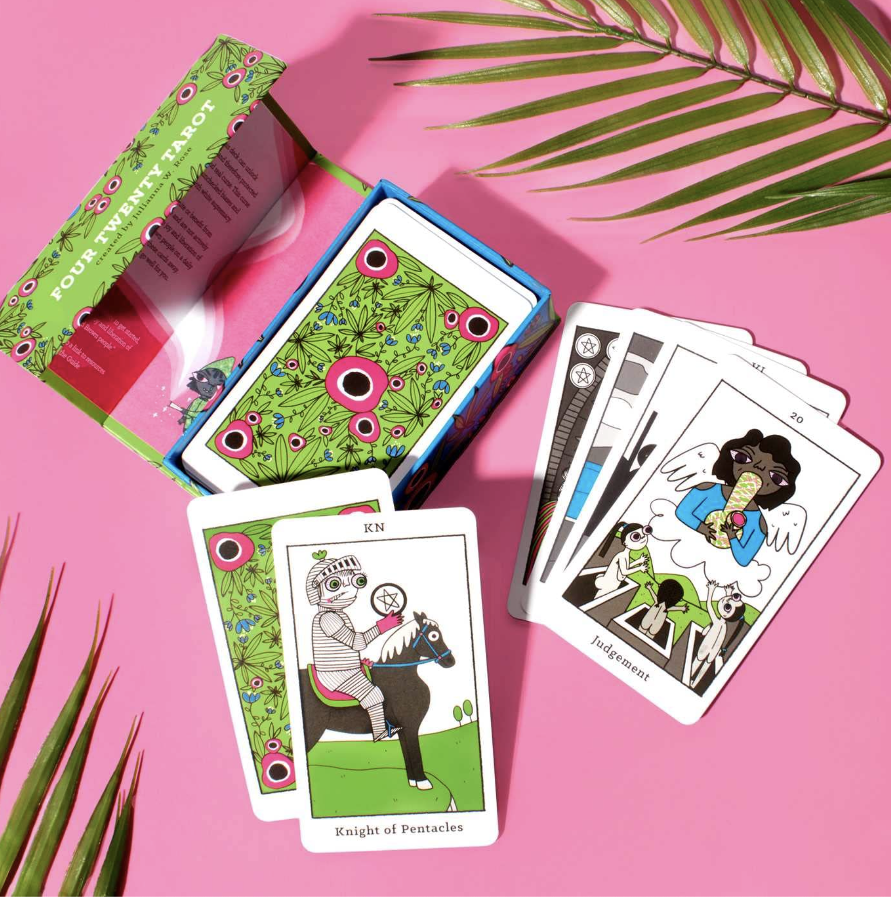 Tarot cards with fun designs on pink background
