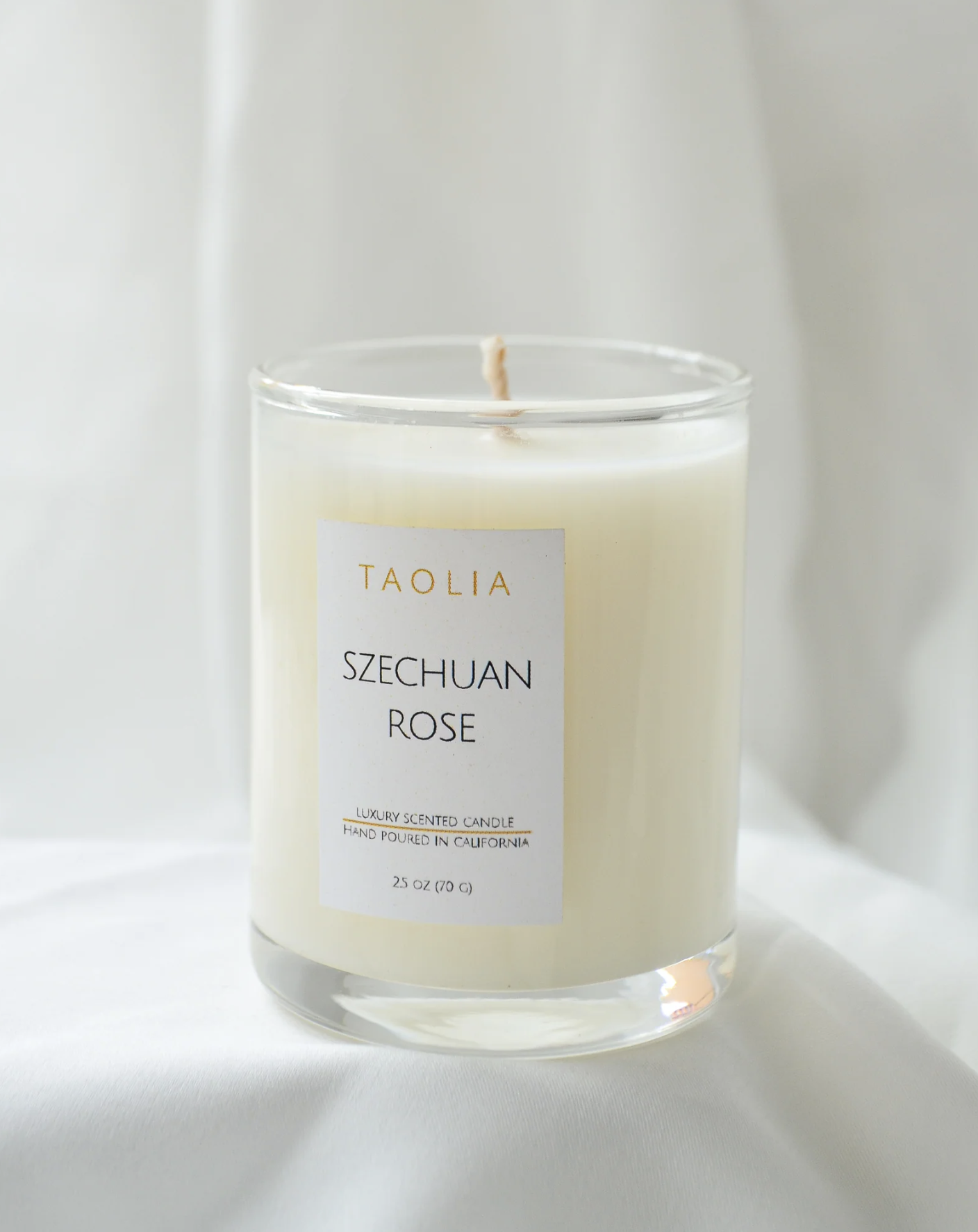 Szechuan Rose Candle sitting on white backdrop.