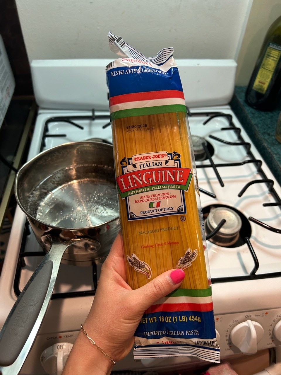 The writer holding linguine pasta