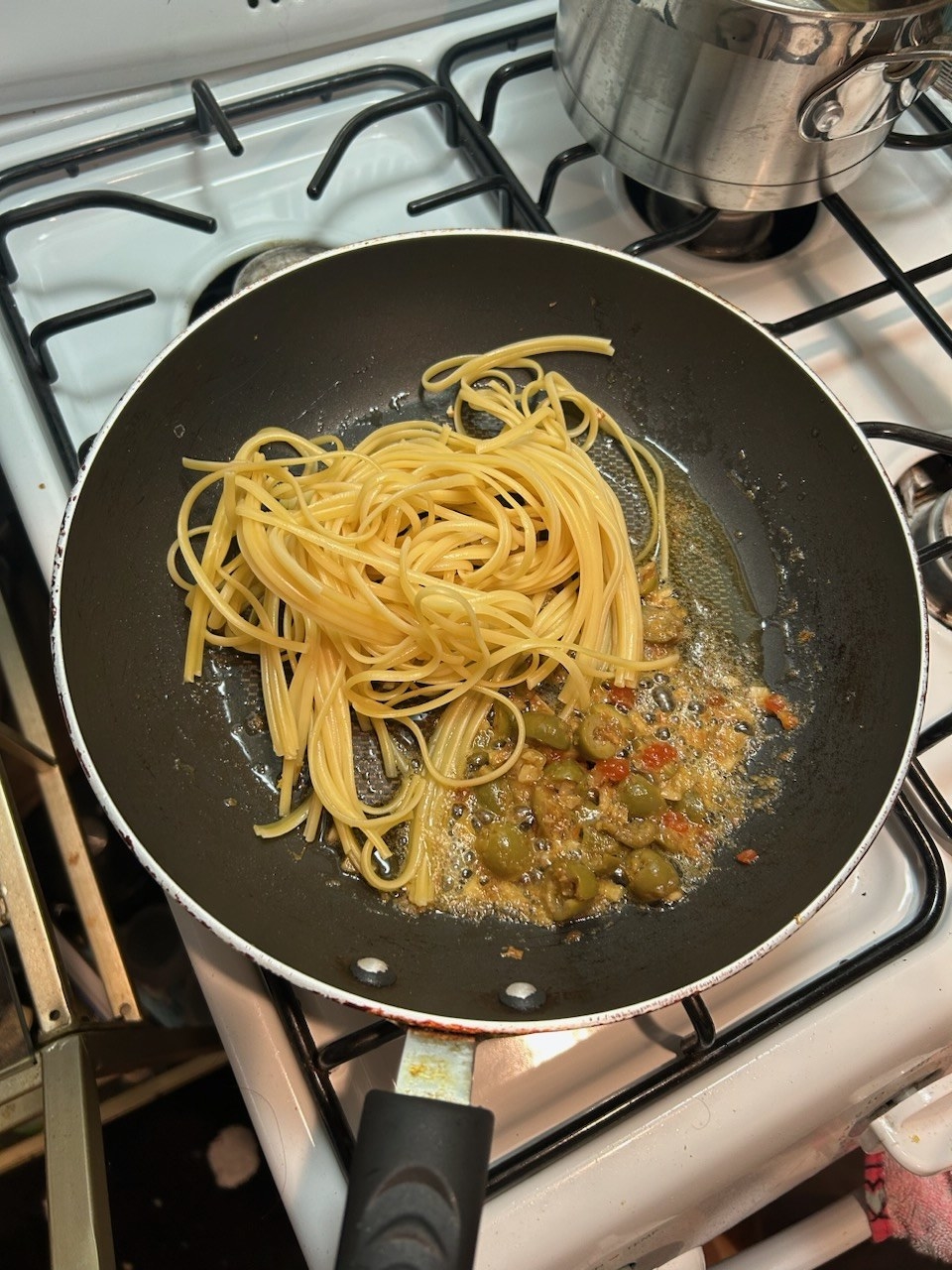 Pasta cooking in sauce