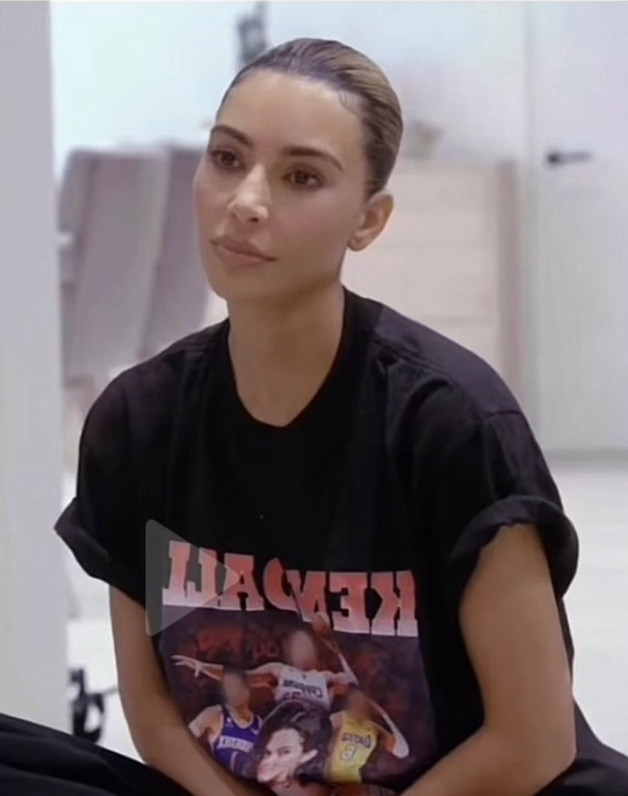 kim in the shirt showing kendall and all the basketball players