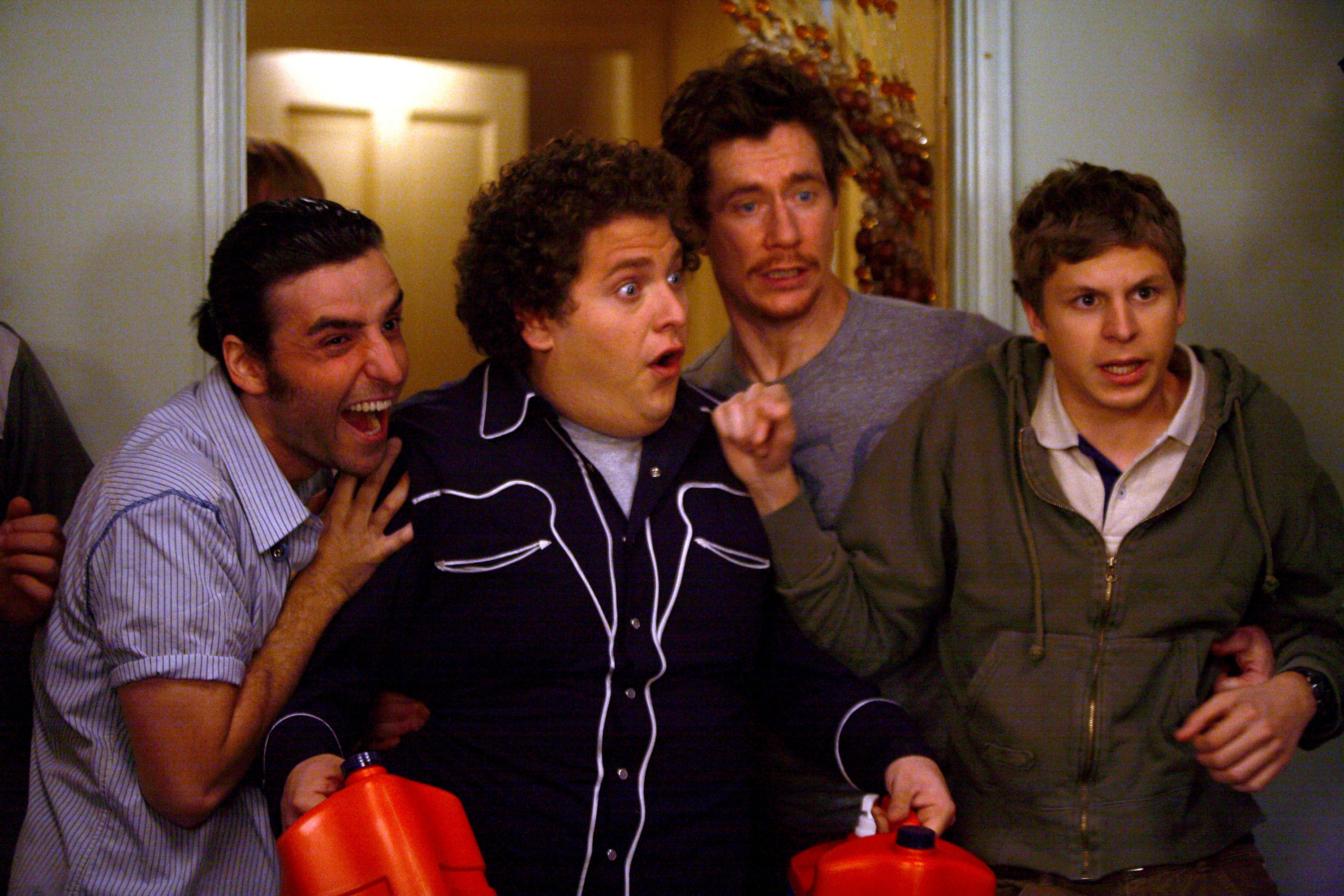 Jonah Hill and Michael Cera are shocked by something that happens at a party