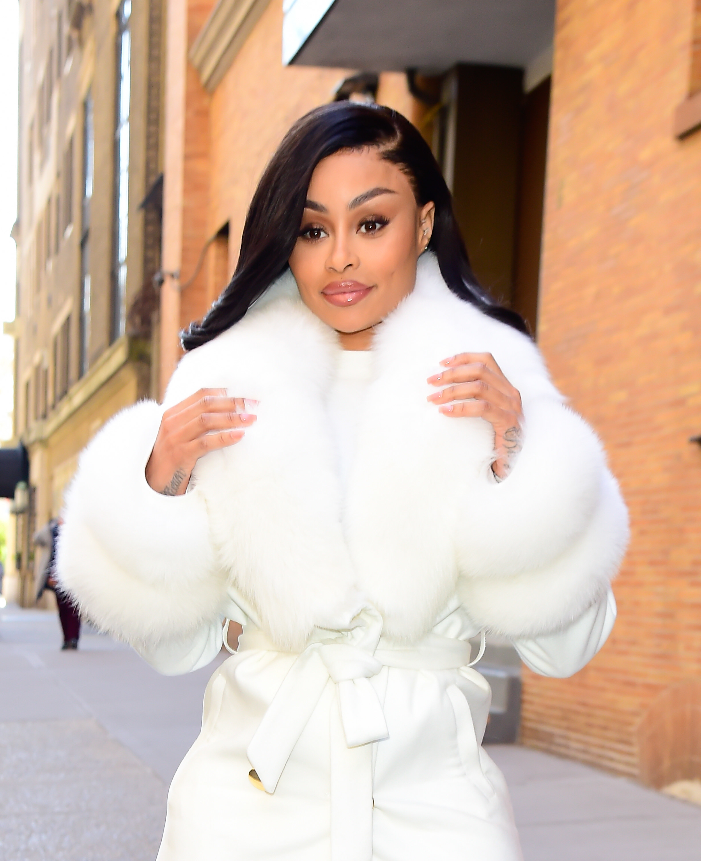 Deliberate? Blac Chyna's boobs pop out of her shirt just as paparazzi start  snapping her (photos)