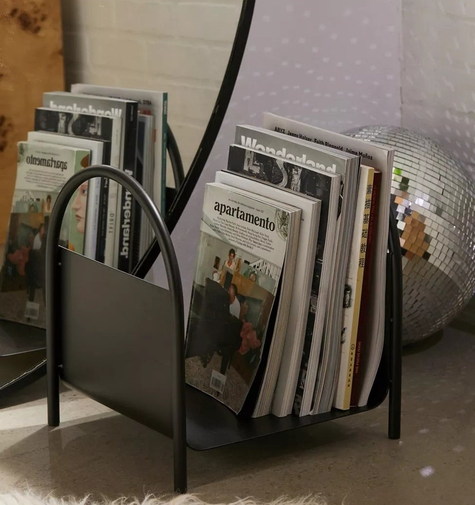 the magazine stand with magazines in it