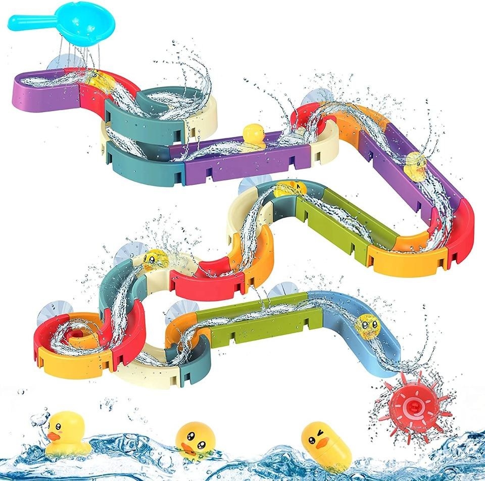 Multi-colored Duck &#x27;n&#x27; Slide water toys with yellow duck toys and lots of water
