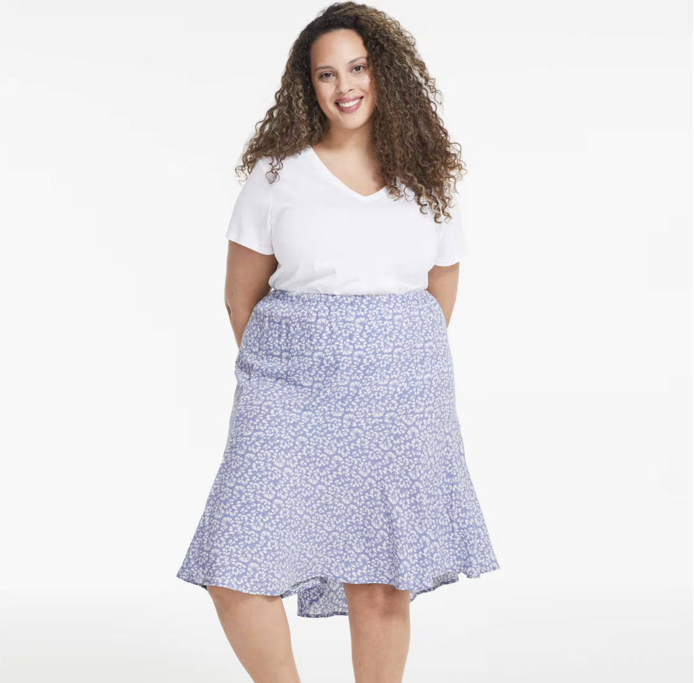 a model wearing the skirt with a plain shirt in front of a plain background