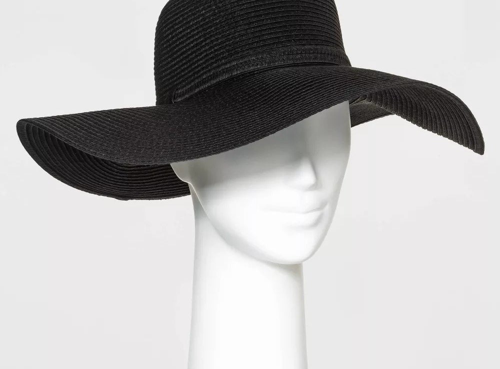 A mannequin wearing the black hat