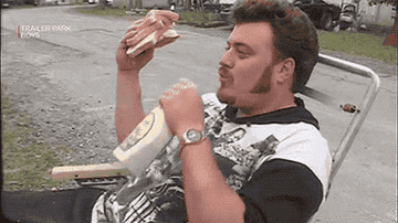 A man drinking ranch from the bottle