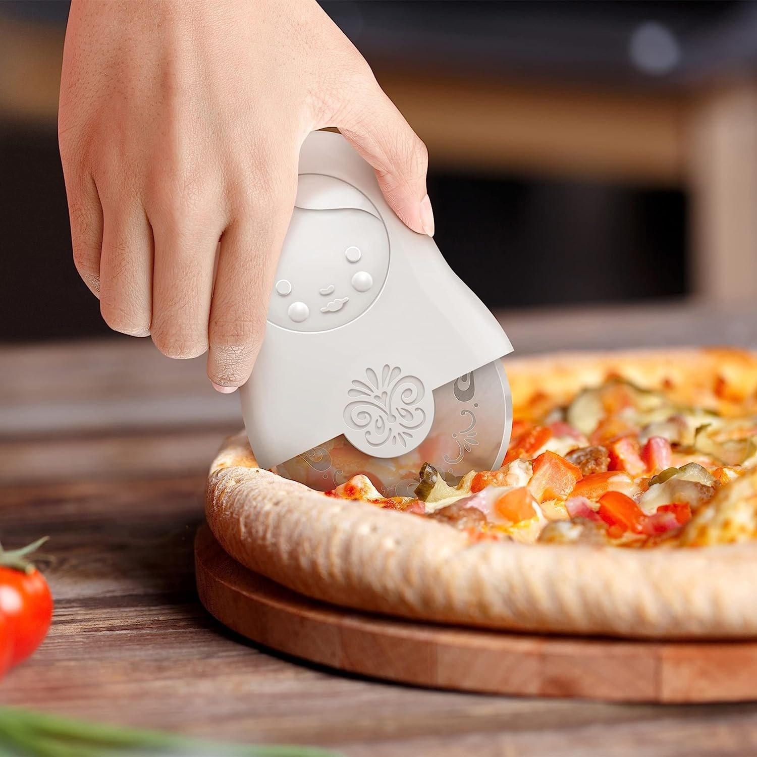 a matryoshka shaped pizza cutter in action
