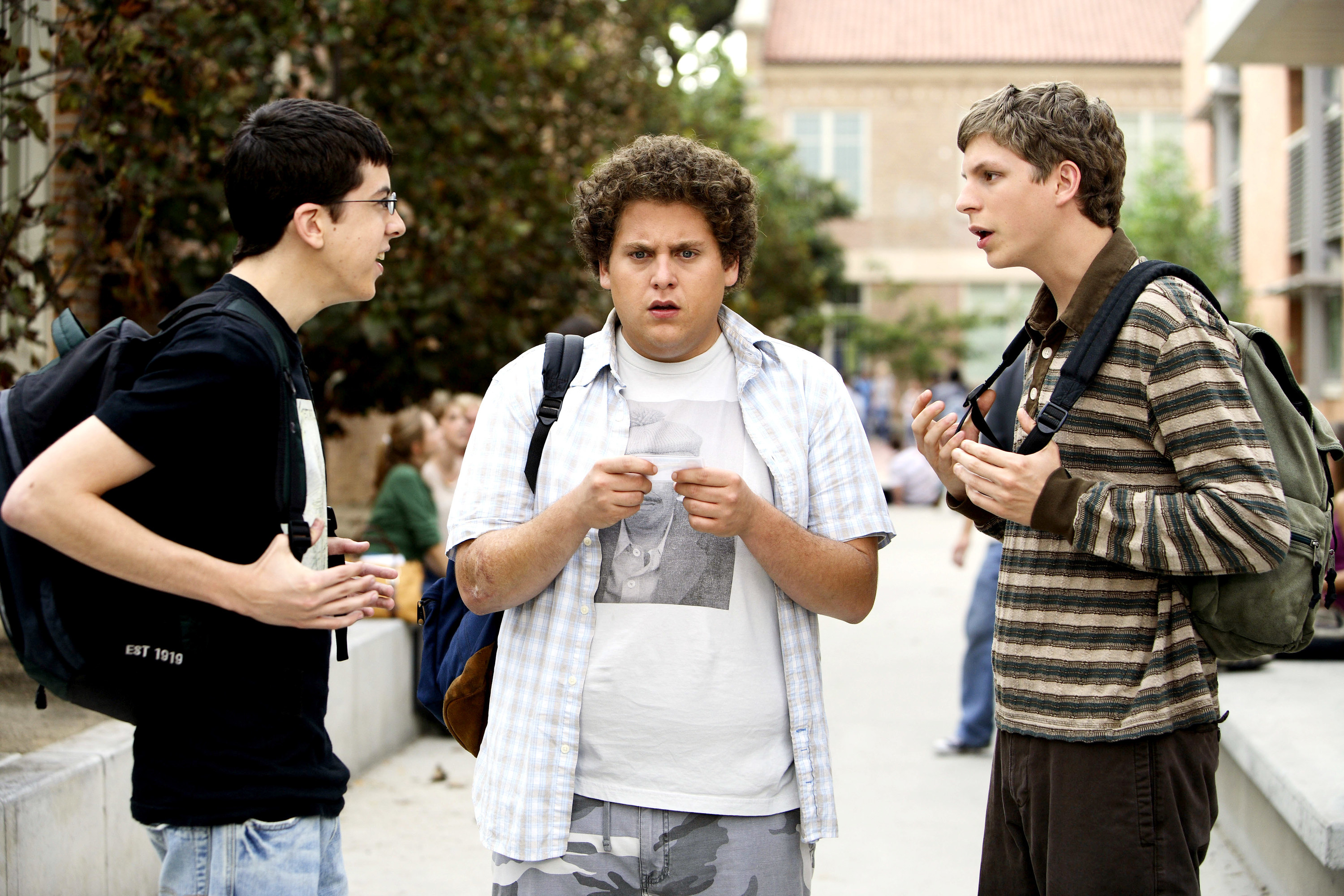 three teen boys outside of school