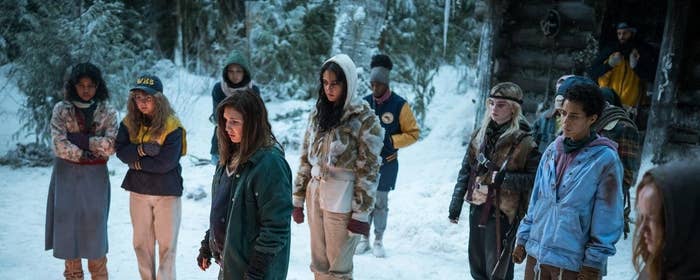 People standing in the snow in a scene from Yellowjackets