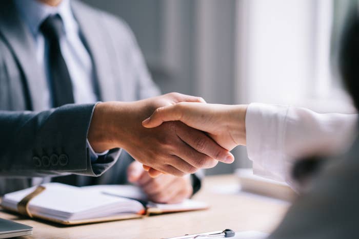 a handshake during a job interview