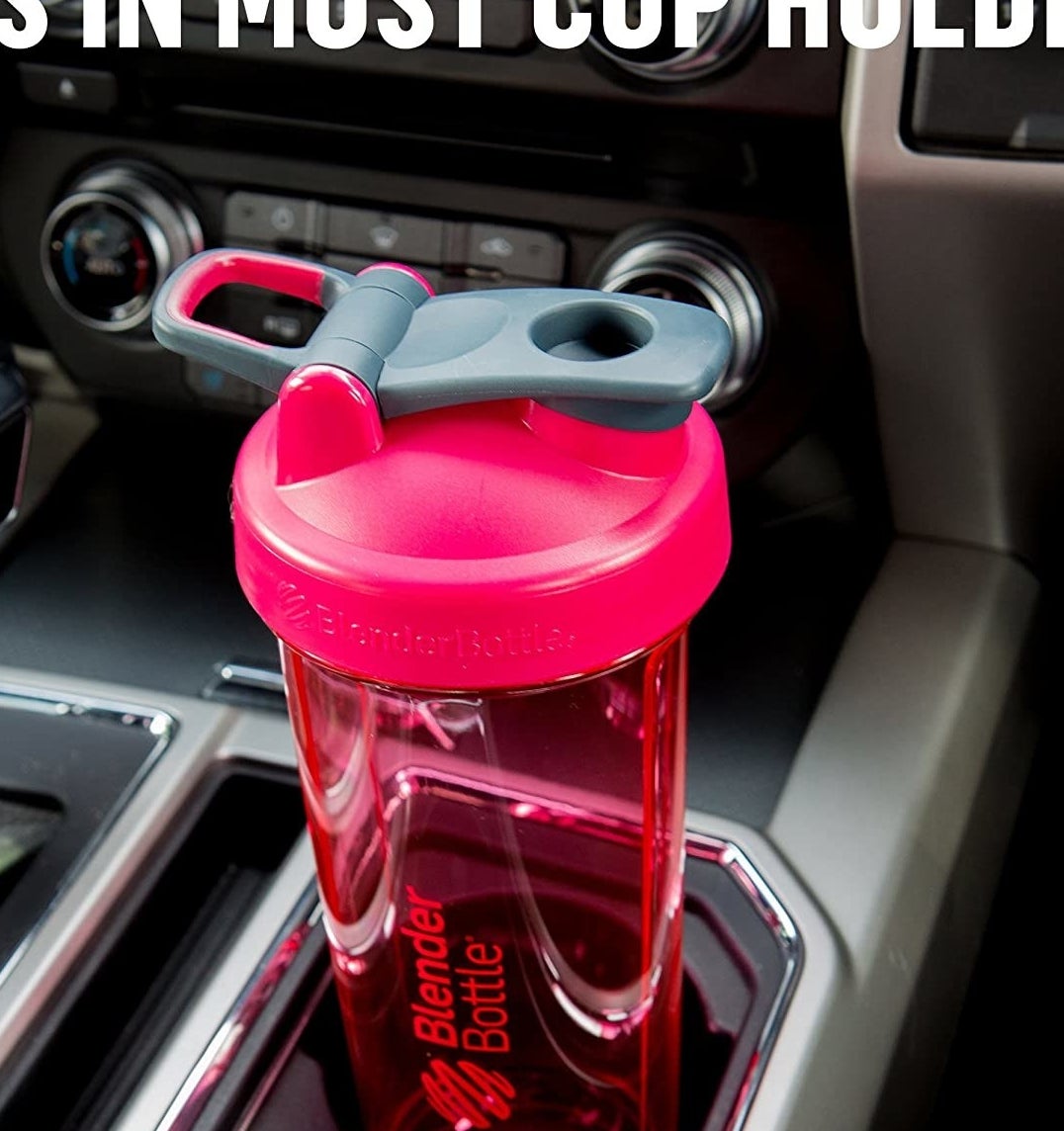 A blenderbottle cup in a cupholder