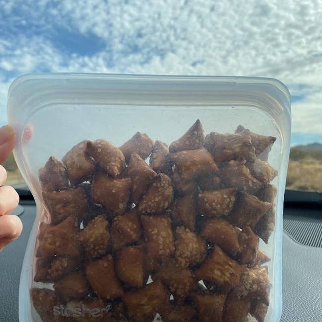 reviewer's reusable storage bag filled with pretzels