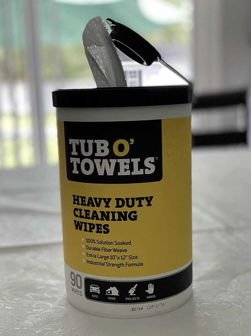 reviewer photo showing the Tub O&#x27; Towels in its black and yellow packaging