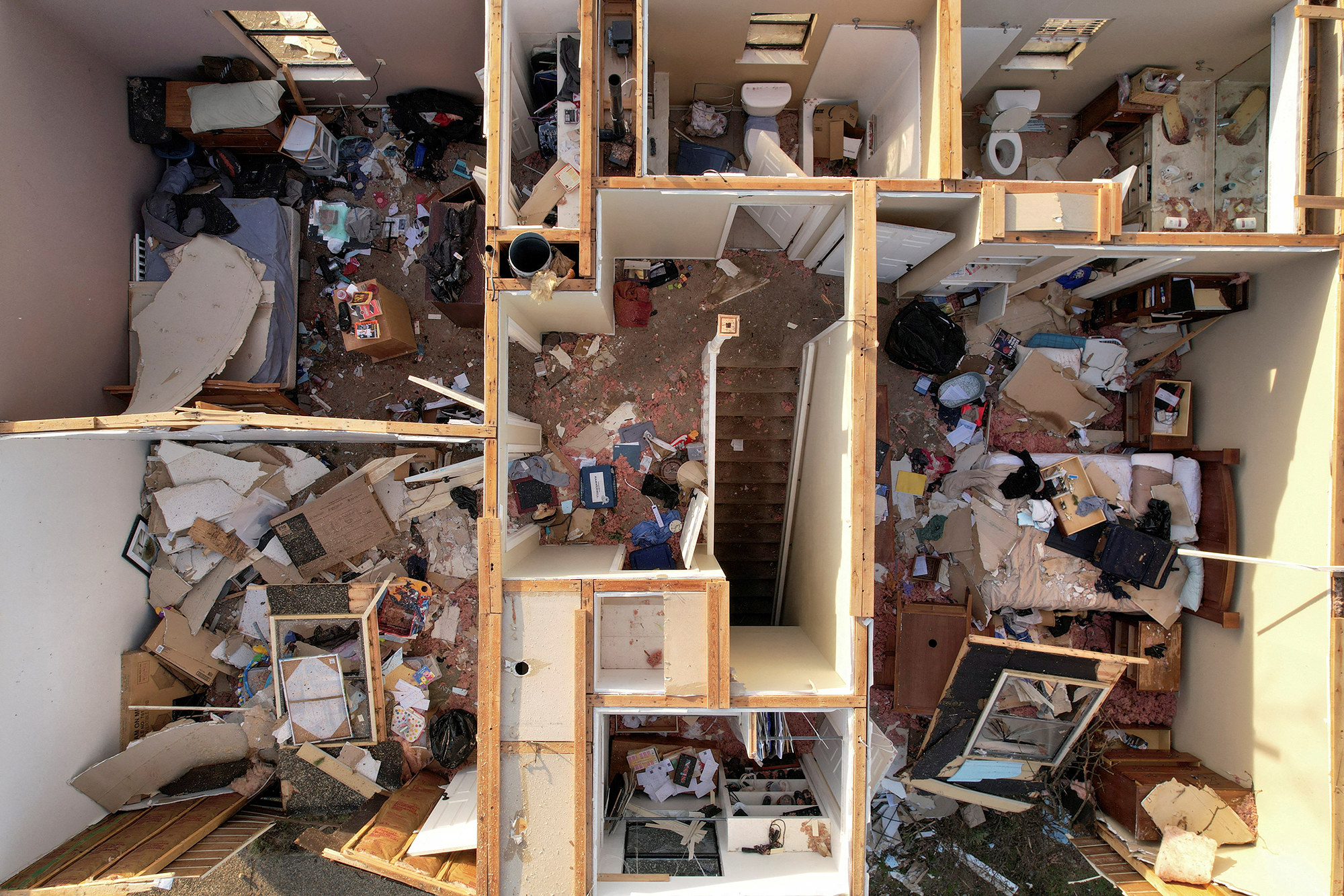 an aerial view of a destroyed home without a roof