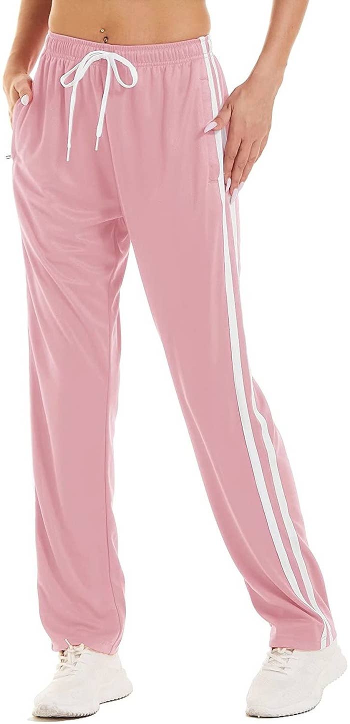 A model wearing pink pants with white sneakers