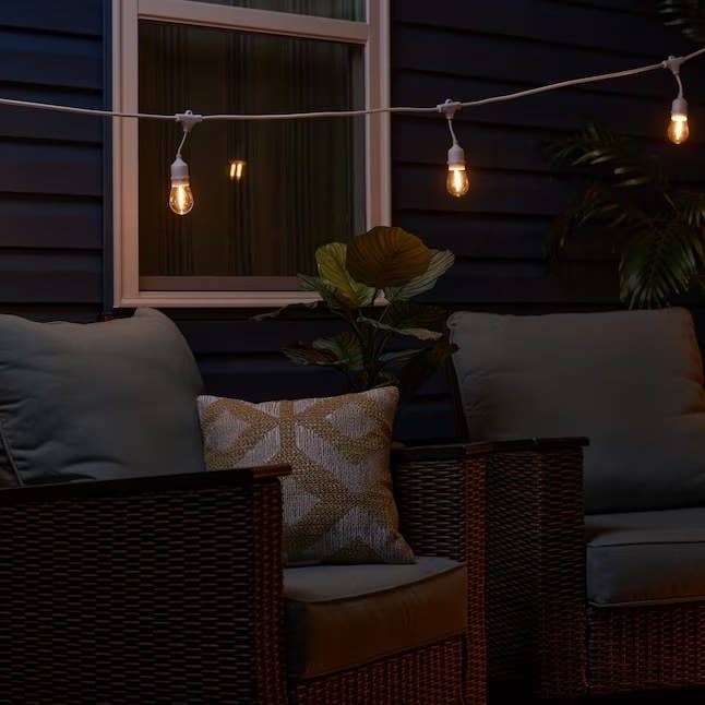 a set of white string patio lights on a patio