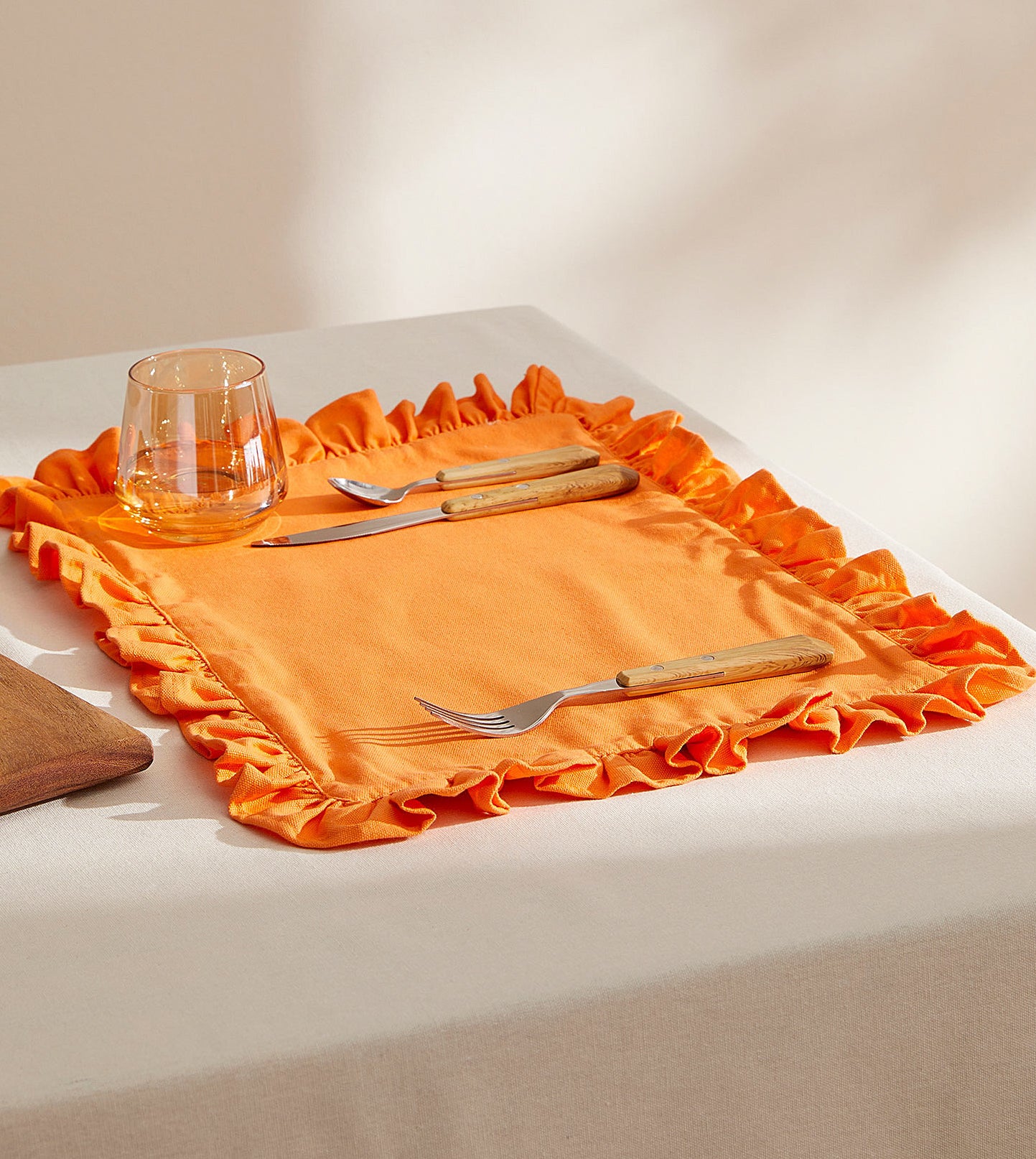 The placemat on a table with silverware on it