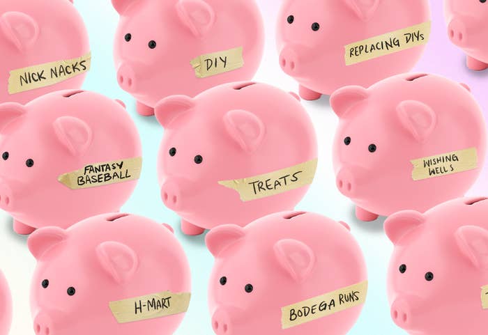 Many piggy banks with masking tape labels that say: "Nick nacks," "Fantasty Baseball," "H-Mart," "Bodega Runs," "Treats," "DIY," "Replacing DIYs," and "Wishing Wells"