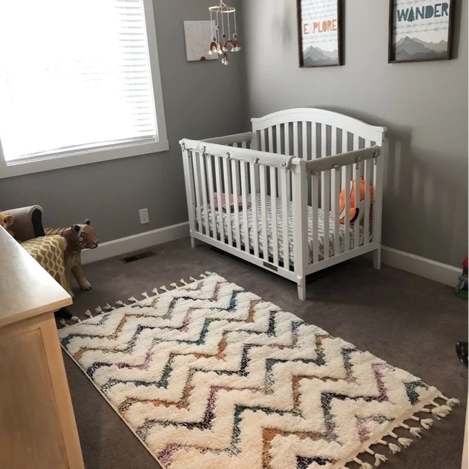the chevron pattern rug in a nursery