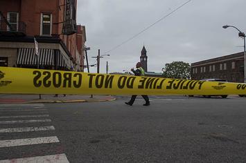 Photograph of police tape at crime scene