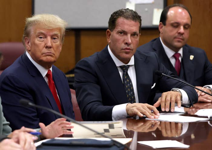 Trump sits next to his lawyers during his arraignment hearing