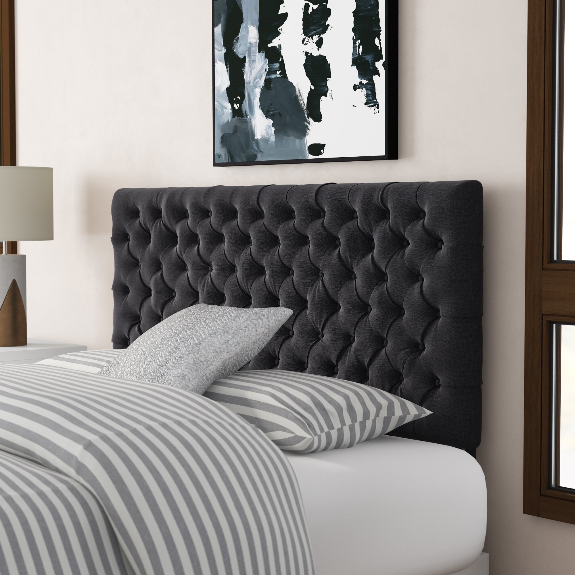 the tufted headboard in charcoal