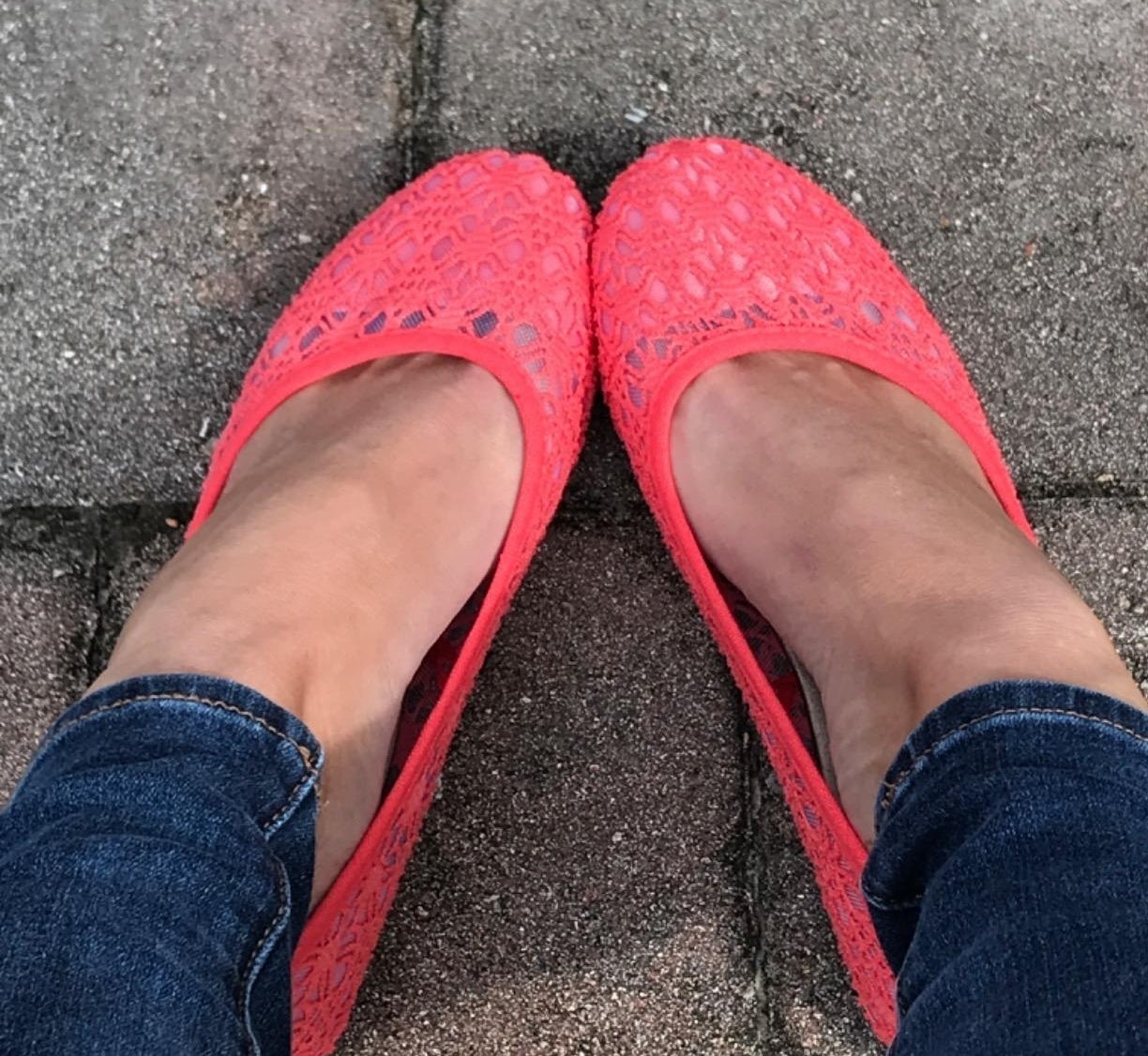 a reviewer wearing the pink flats