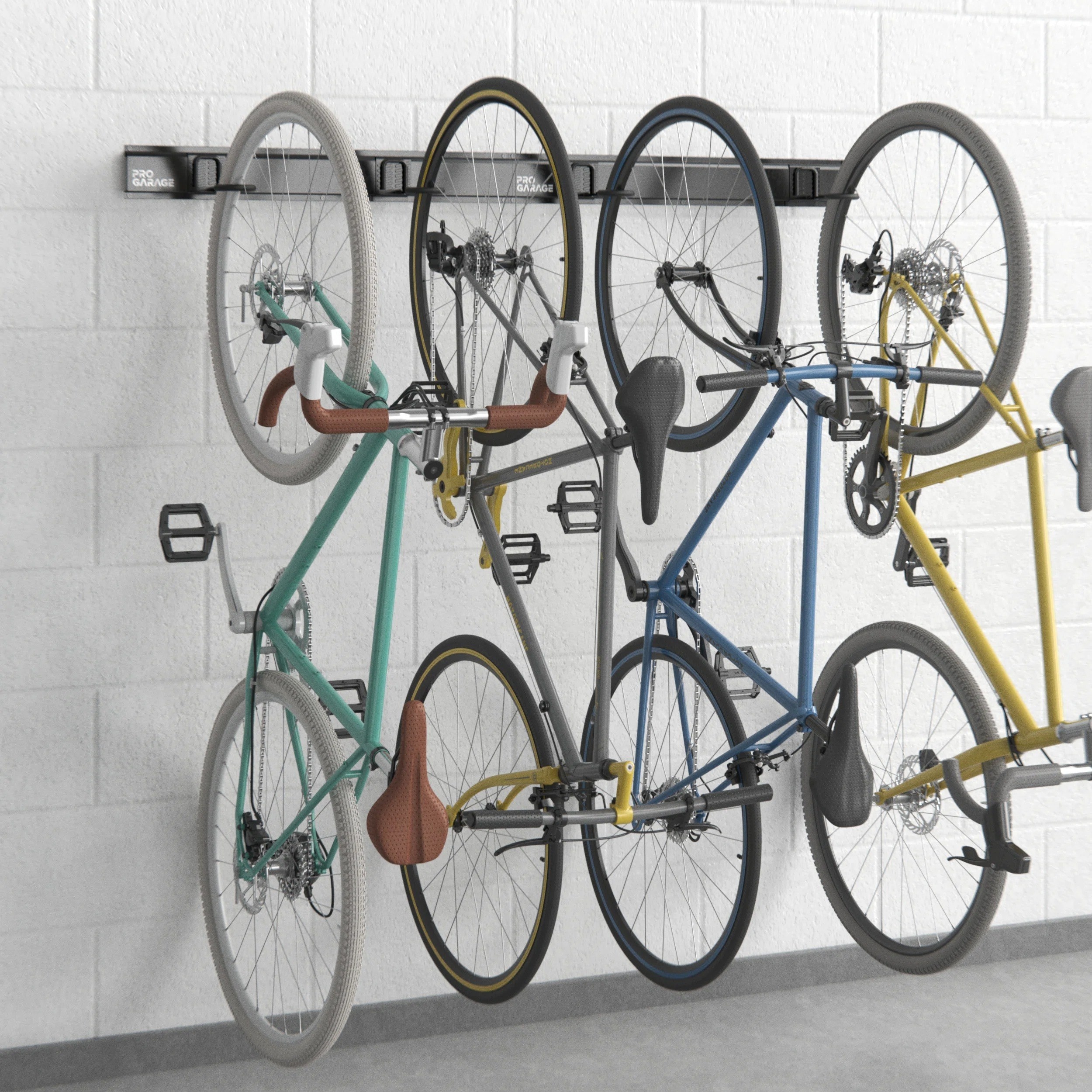 four bikes hanging from the bike rack on a wall