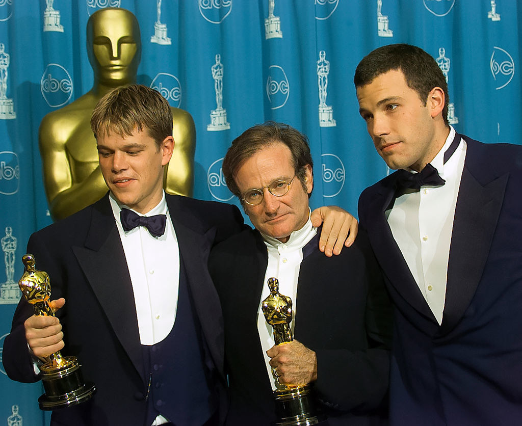 From left to right: Matt, Robin, and Ben holding their Oscars