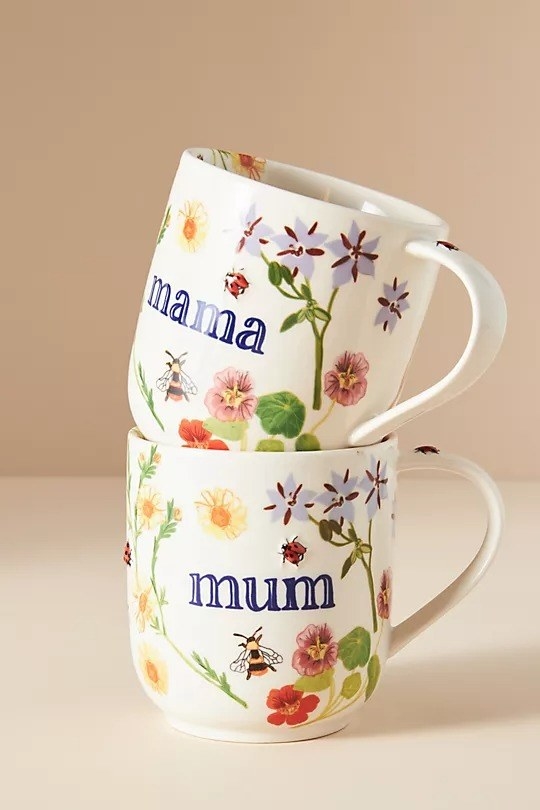 two floral mugs stacked: one says mum and one says mama