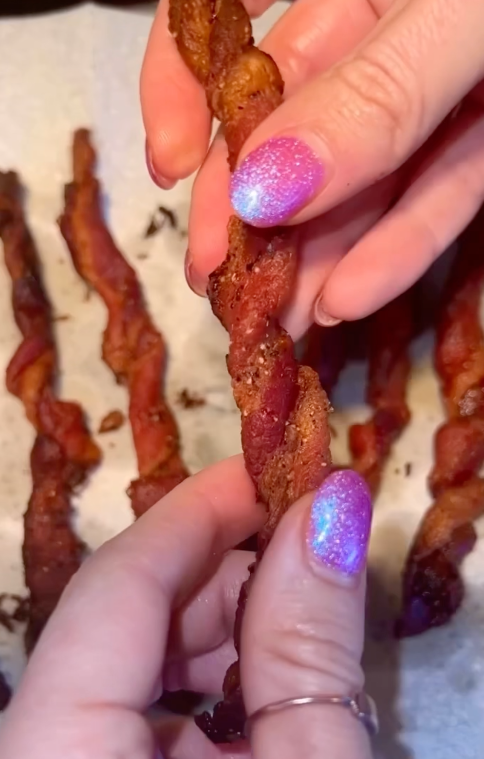 The author holding twisted bacon