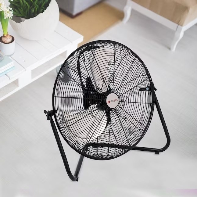 a black three-blade fan in a living room