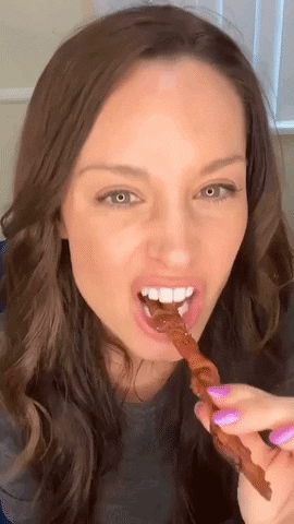 The author eating bacon