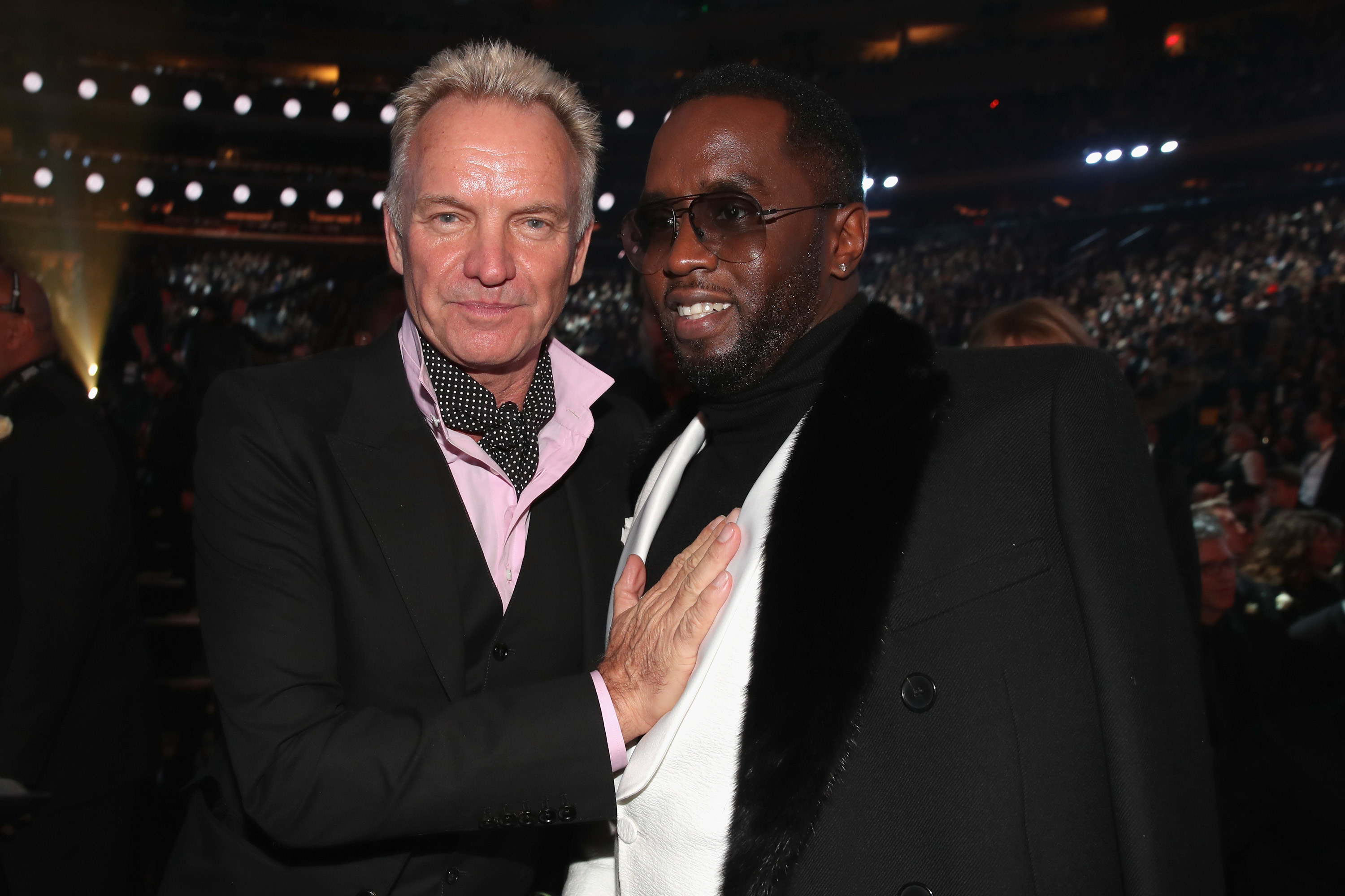 Sting with his hand on Diddy&#x27;s chest