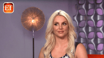 Camera panning to a close-up of Britney Spears