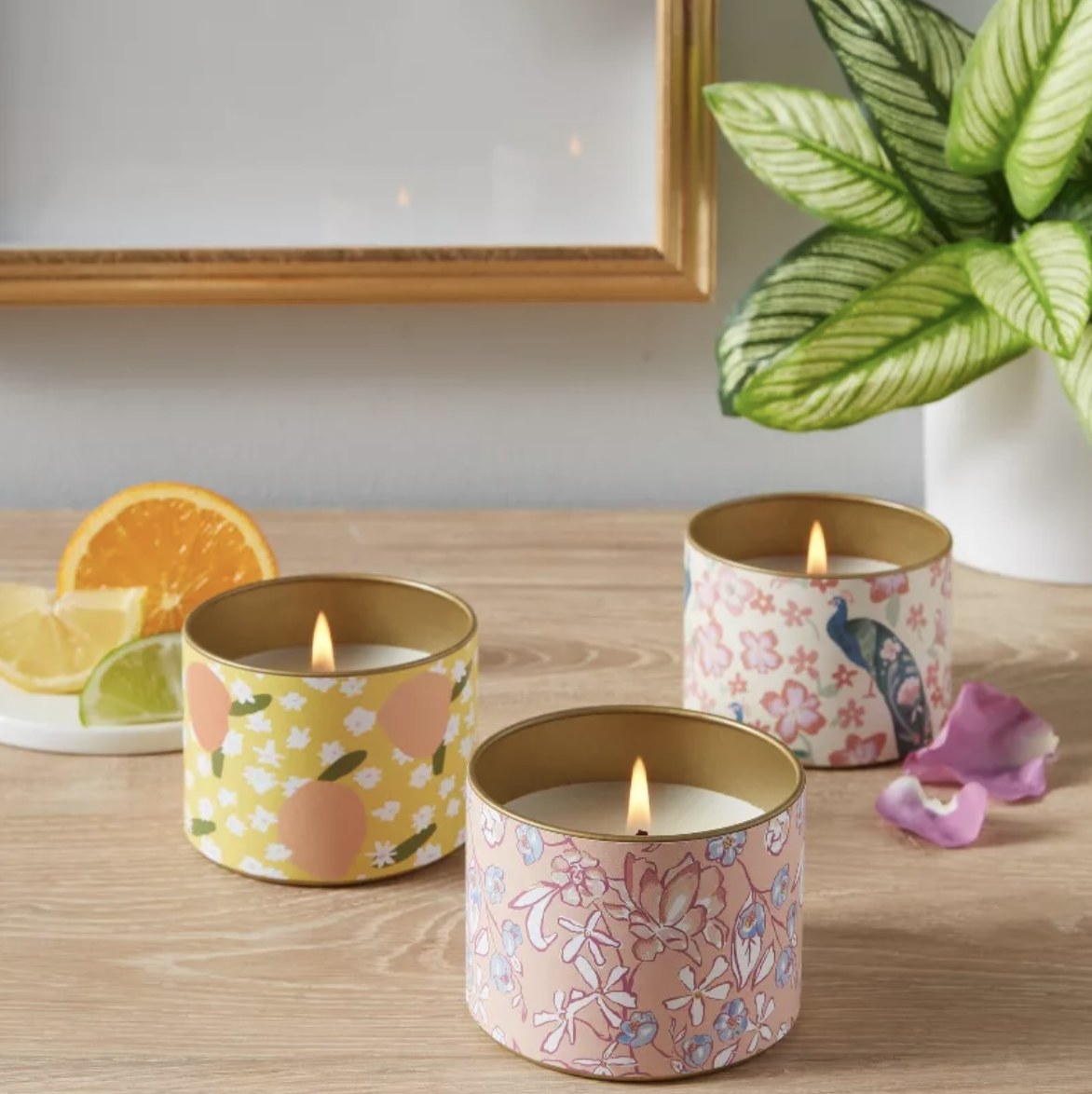 A set of three tin scented candles