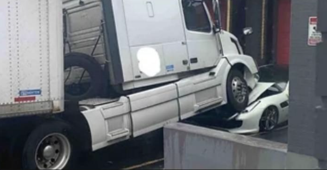 A truck on top of a Ferrari