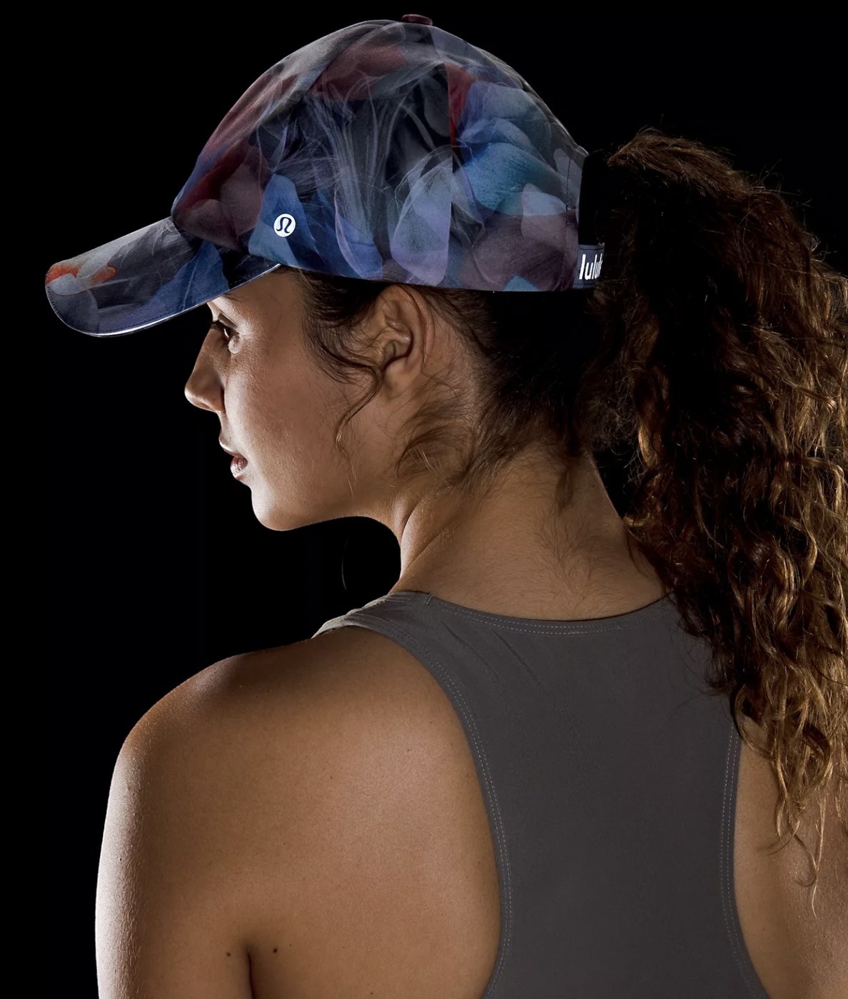 Model wearing the blue and violet patterned hat