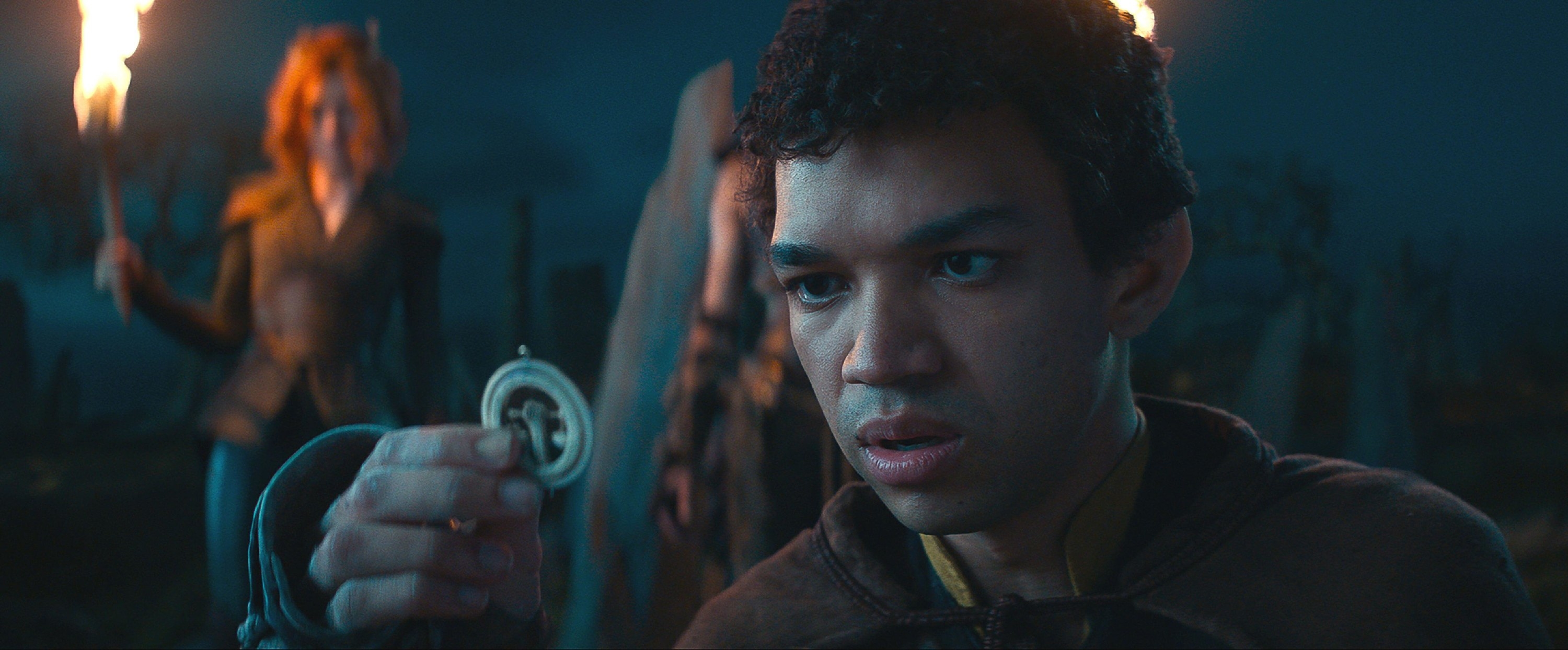 Justice Smith holds up a weird pendant