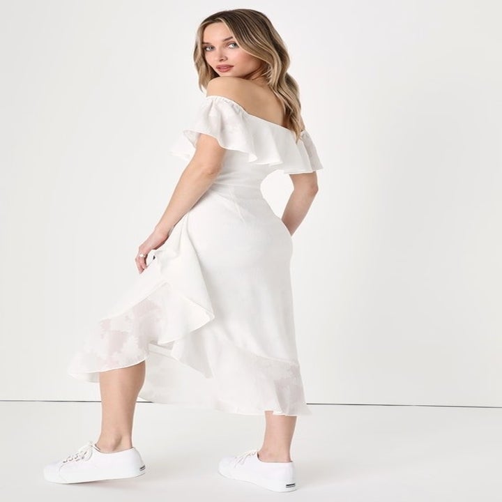 Image of model wearing white dress