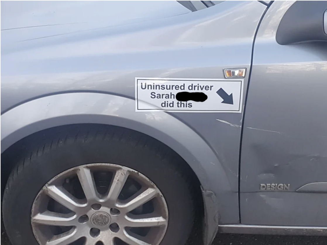 Note on car: &quot;Uninsured driver Sarah ___ did this&quot; and arrow pointing to scratch
