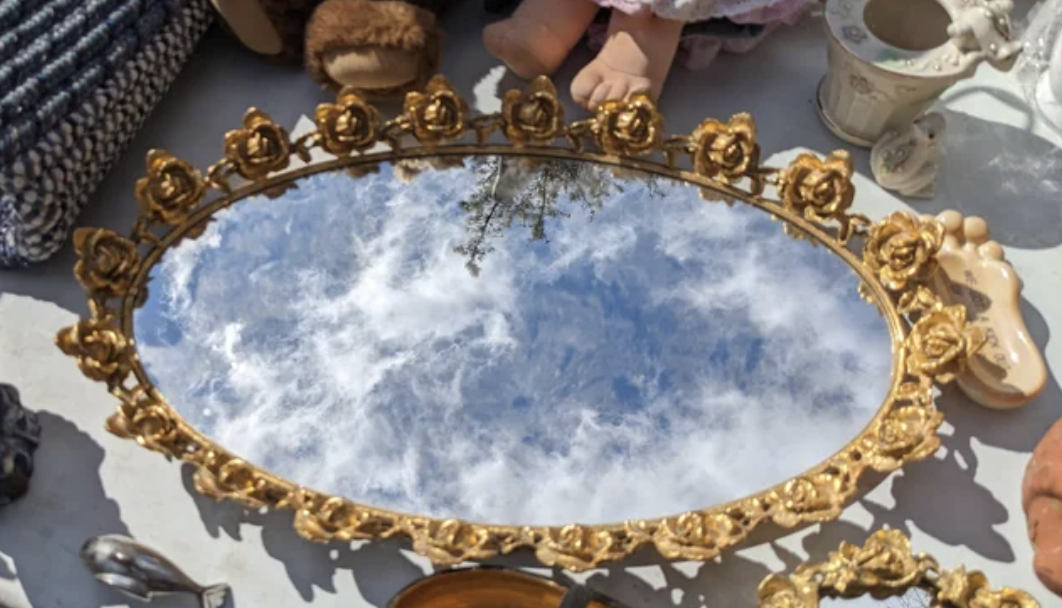A mirror tray reflecting the sky