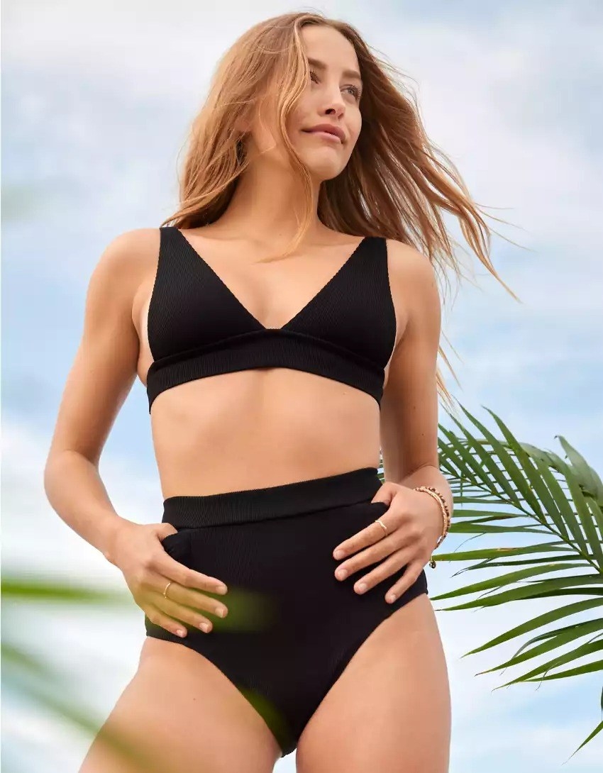 A model in the black ribbed bikini