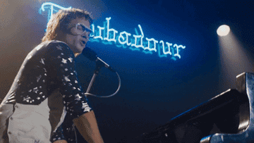 gif from film &quot;Rocketman&quot; of Elton John putting his foot on the piano
