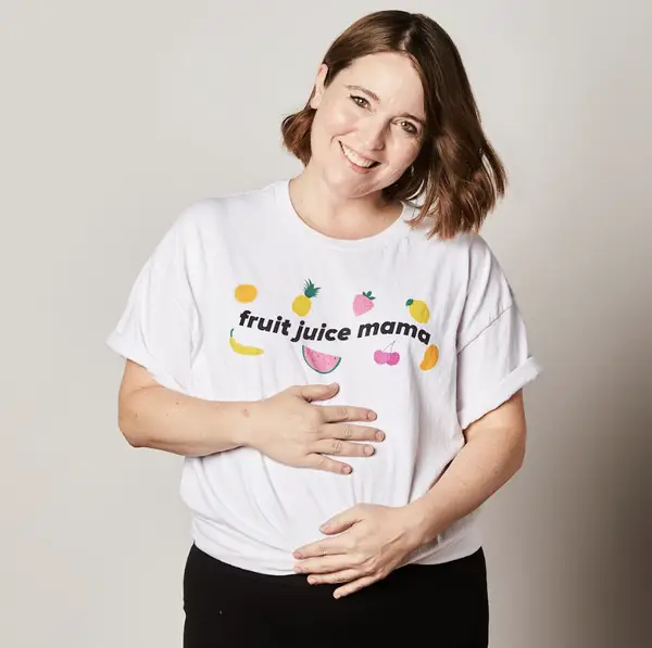 Katie Aubin wearing a T-shirt that says &quot;fruit juice mama&quot;
