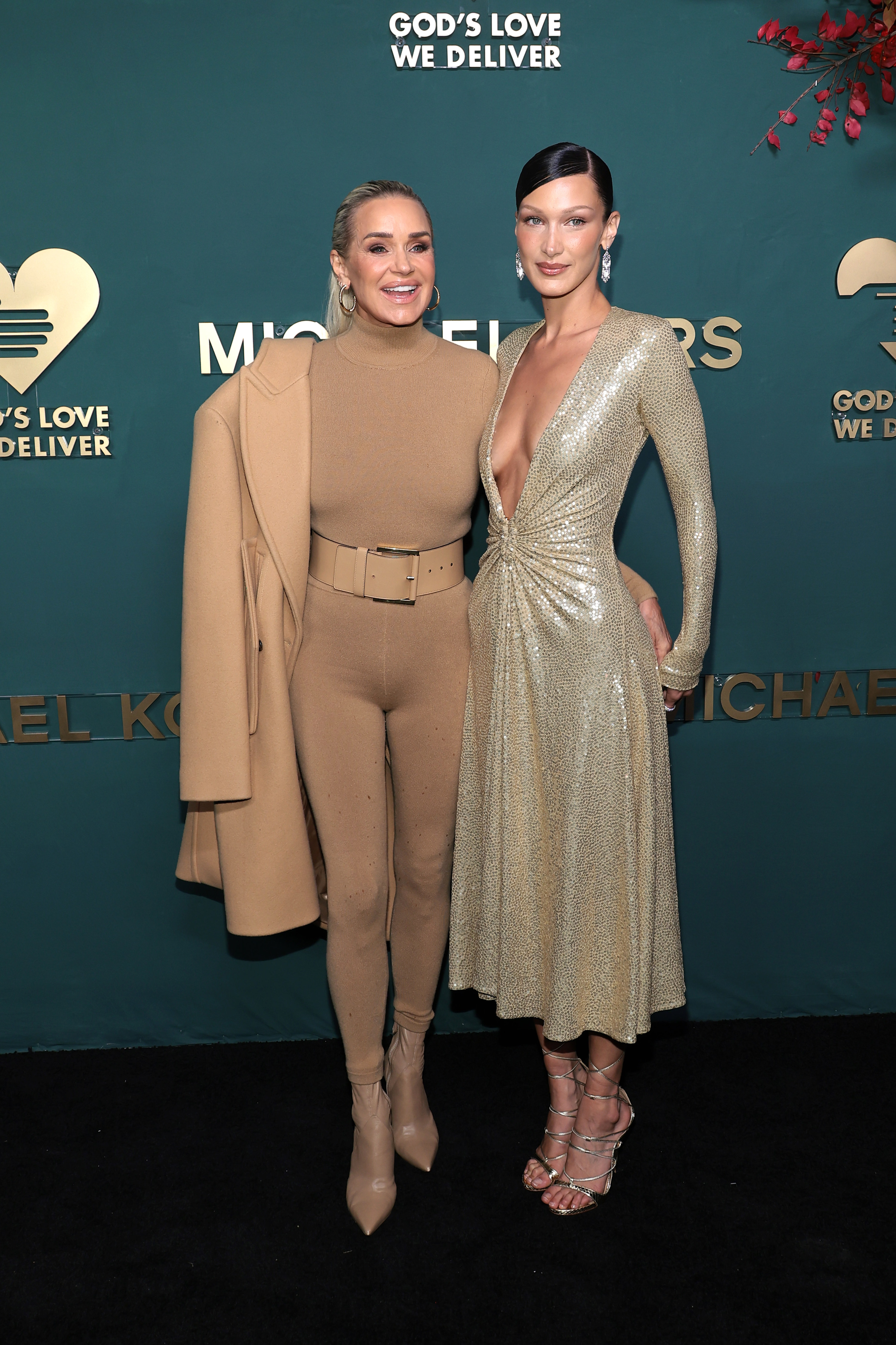 Yolanda Hadid poses beside Bella Hadid at event