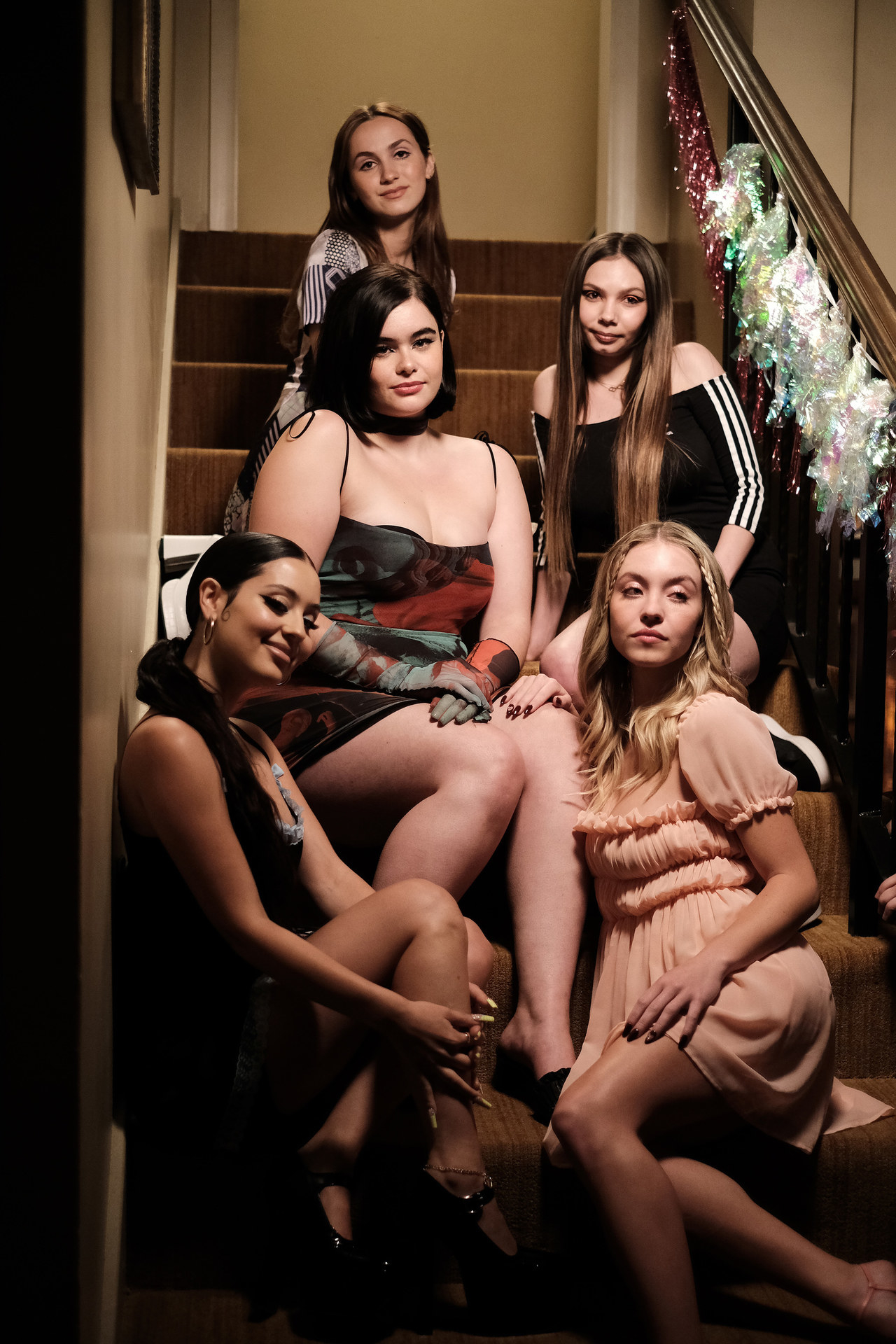 the group of girls posing on a staircase